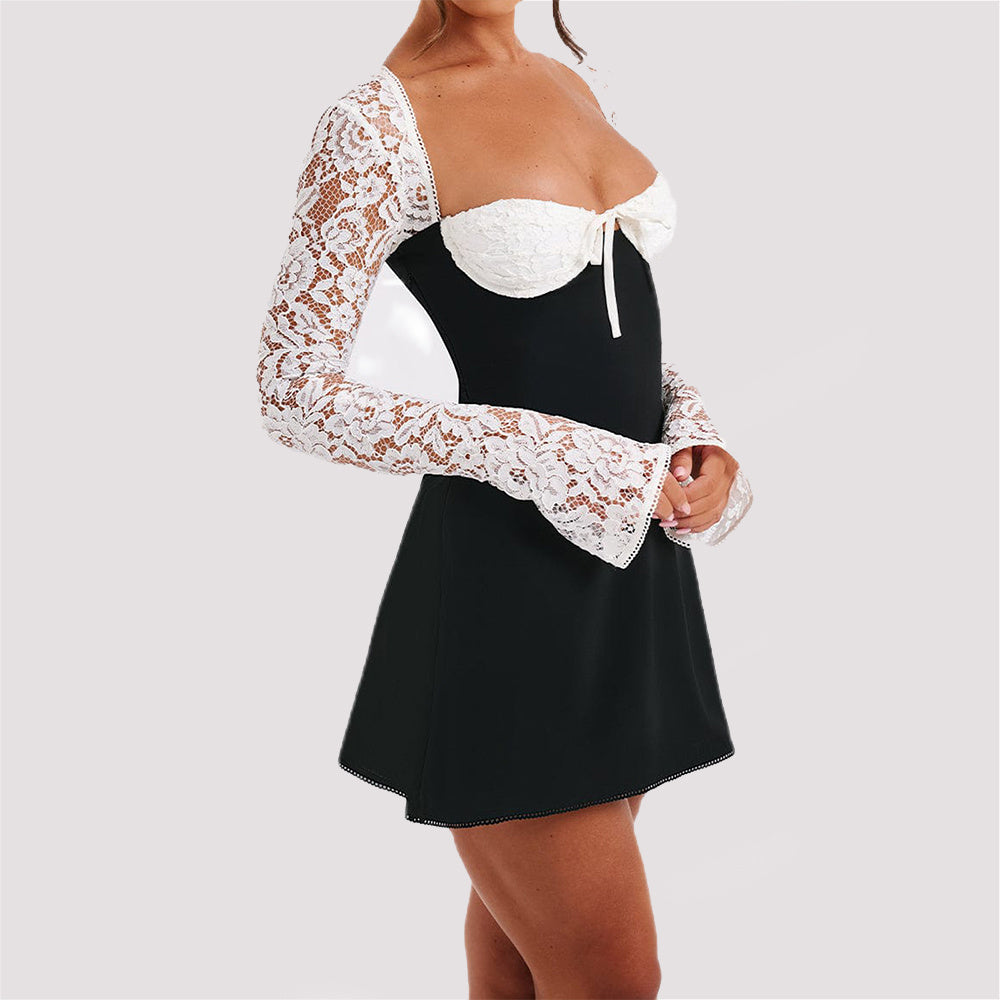 Woman in backless lace dress with long sleeves