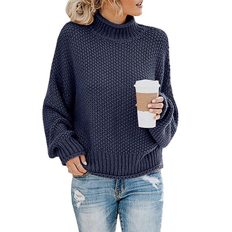 Soft knit turtleneck top styled with boots and denim