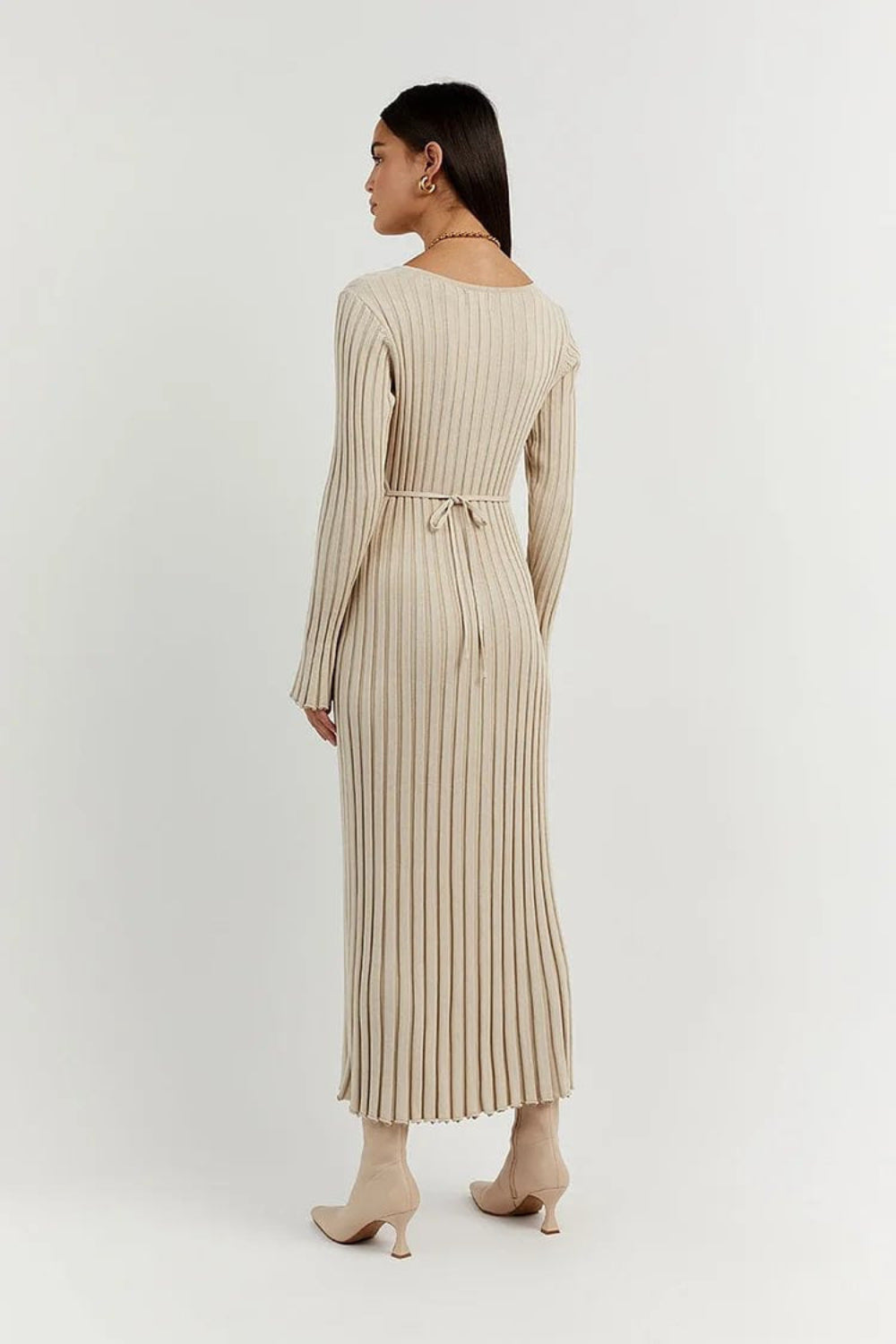 Side profile of fashionable women's knitted dress for winter
