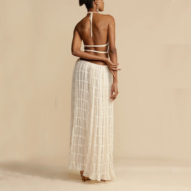 Summer outfit with pleated skirt and halter top for resorts
