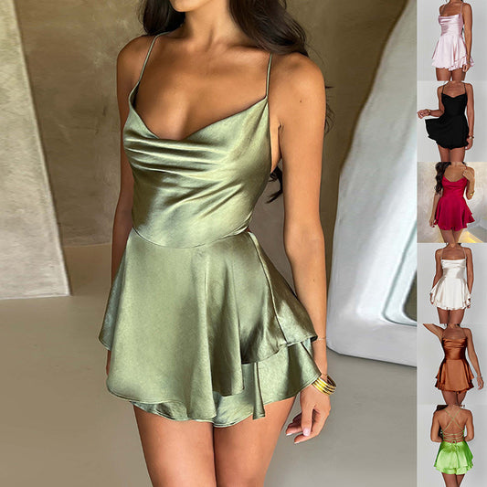 Woman in satin A-line dress with lace-up back and spaghetti straps