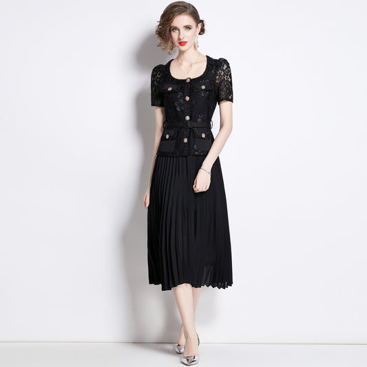 Woman wearing black lace embroidery pleated dress