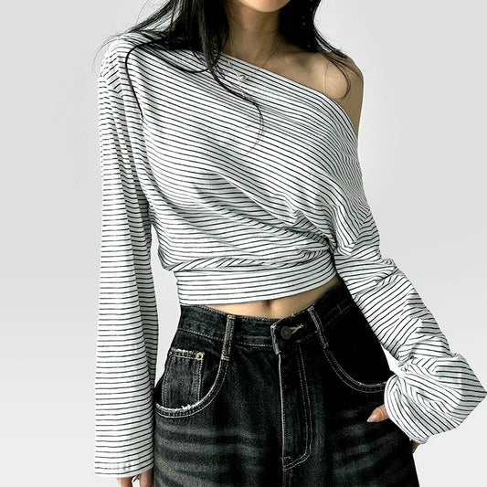 Woman wearing a casual loose shoulder slimming long sleeve top
