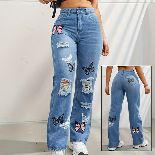 Woman in high-waisted butterfly print ripped jeans outdoors