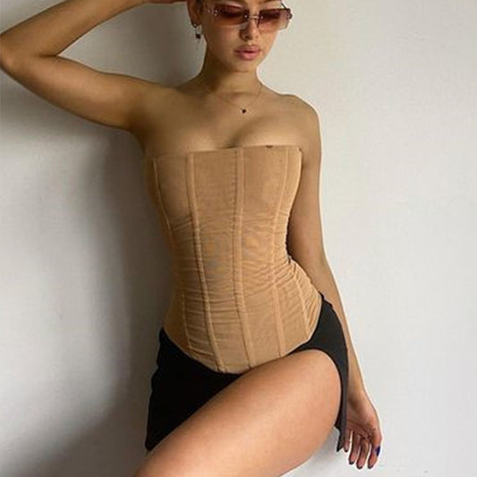 Woman wearing mesh corset crop tube top outdoors
