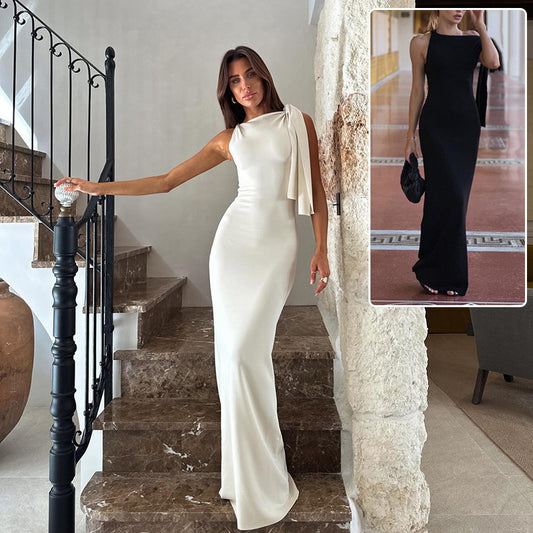 Woman in one-shoulder ribbon dress with slim evening silhouette