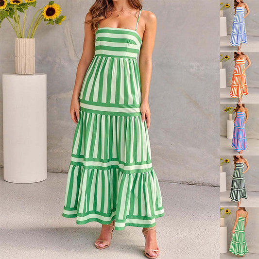 Woman in striped backless summer dress with pockets